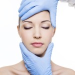 Plastic surgery touching female face