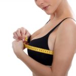 Lady measuring her chest with a tape measure, Breast Reduction, DEARBORN HEIGHTS, MI 48127