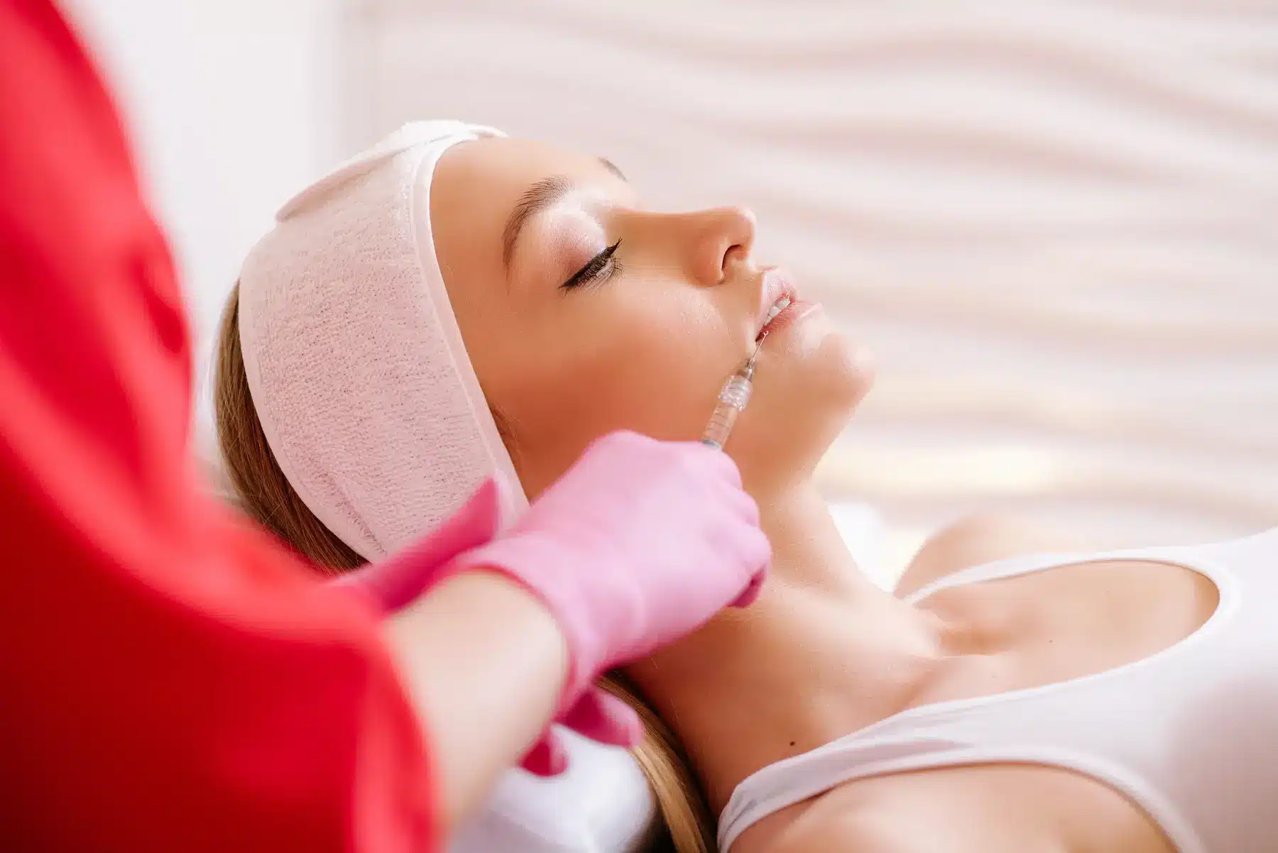 Woman receiving lip filler injections for lip enhancement in Plymouth, MI